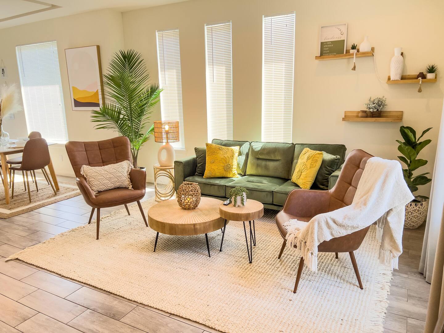 Warm bohemian living room with olive sofa and inviting seating